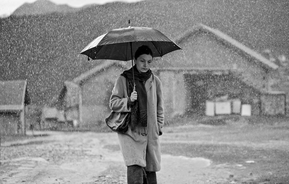 Ruveyda walks through the pouring rain