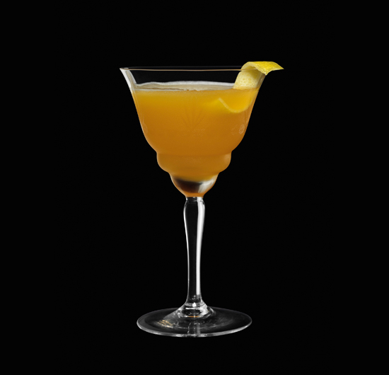 The Precursor The Precursor, served in a tall Martini glass with a slice of lemon juice