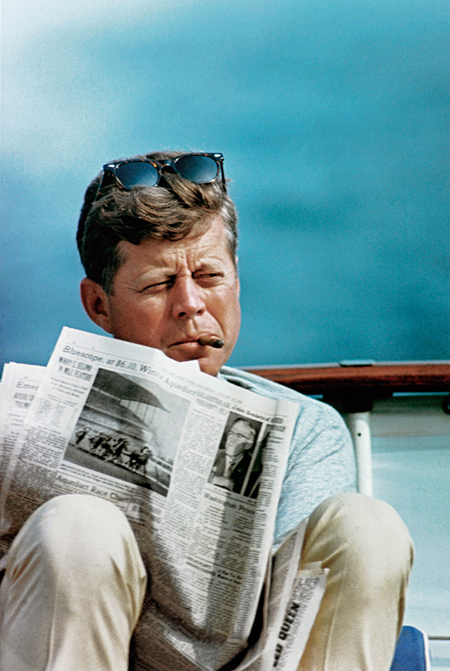 U.S. President John Fitzgerald Kennedy on board his sailboat Honey Fitz, circa 1960–63 © Corbis