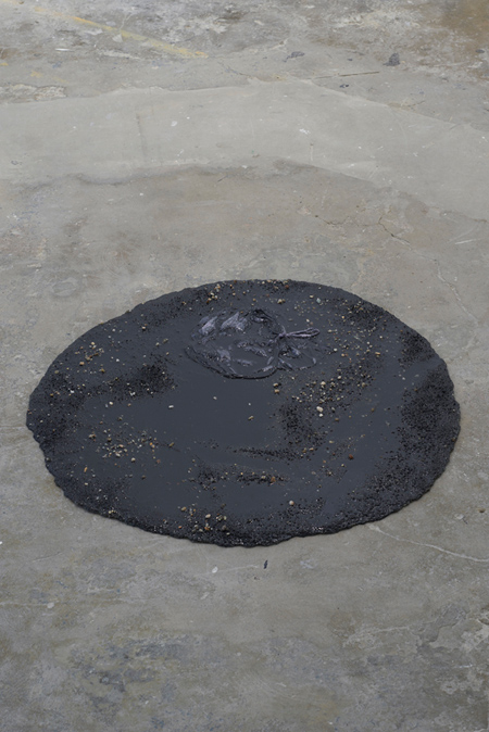 Marlie Mul  Puddle (Black outlet), 2013 sand, resin and plastic bag 2 x 77 x 76 cm / 1 x 30 x 30 ins