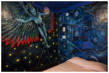 blue corseted and winged-creature mural