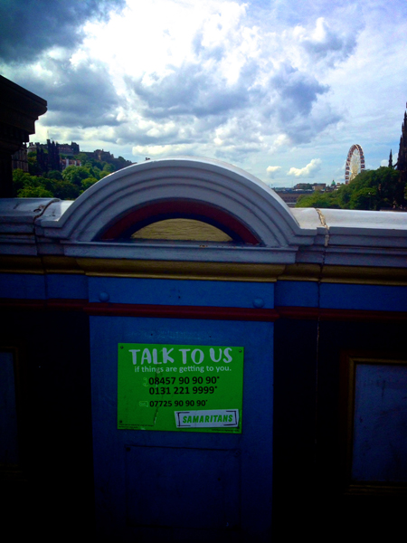 Samaritans sign on a railway bridge.Image The Vacuum Cleaner
