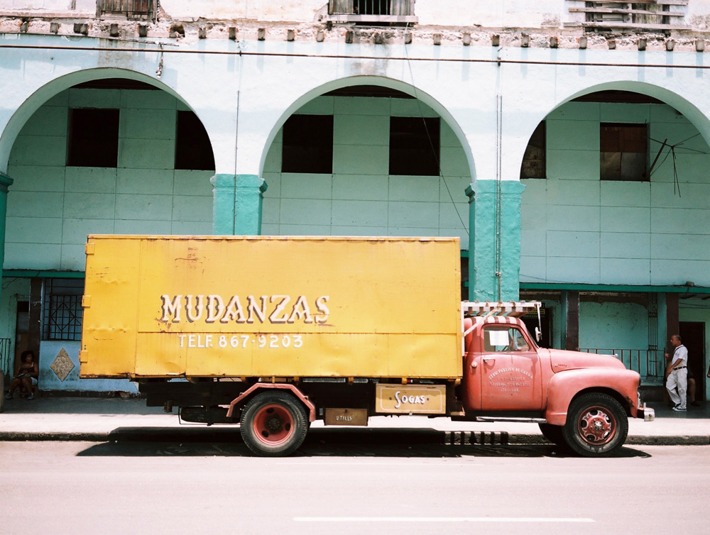 Orange Mudanzas truck in central Havana