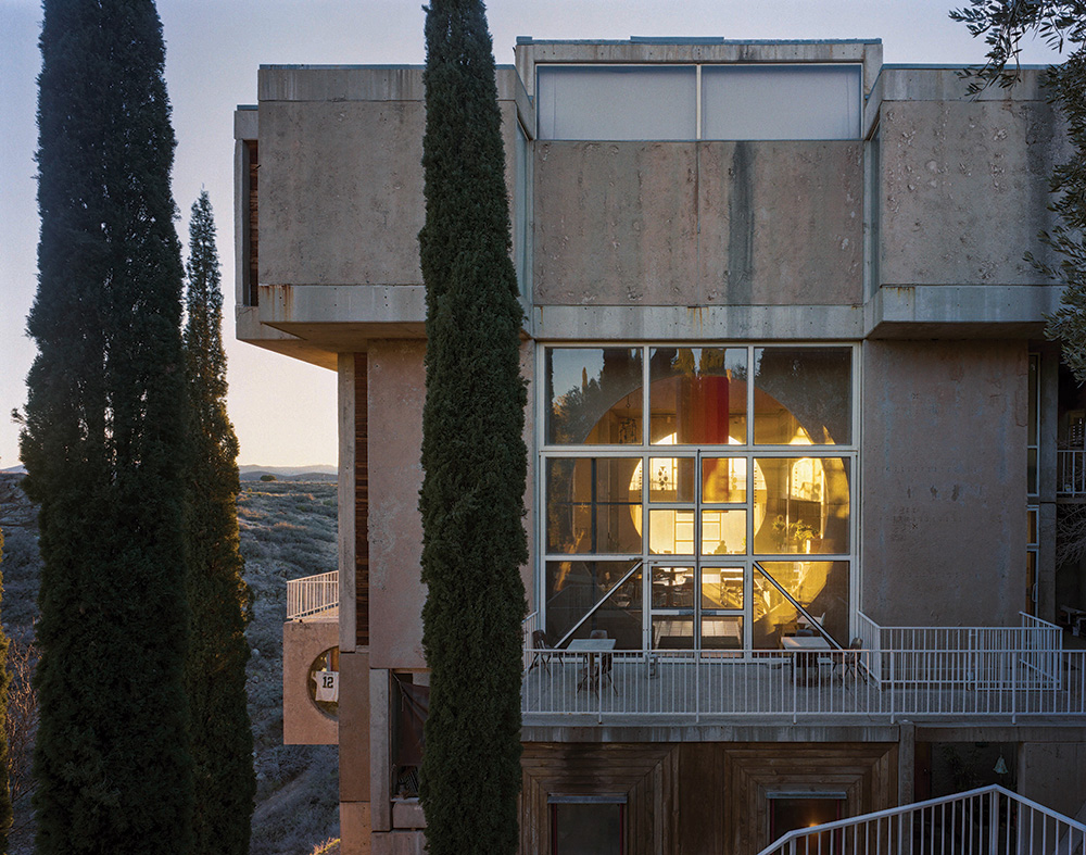 Perched on a cliff, the Crafts III building contains apartments, a cafe and a visitors centre that are kept warm in winter by the low sun on its south side